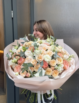 Bouquet with peony roses, roses, lisianthus (eustoma) combined with fragrant eucalyptus